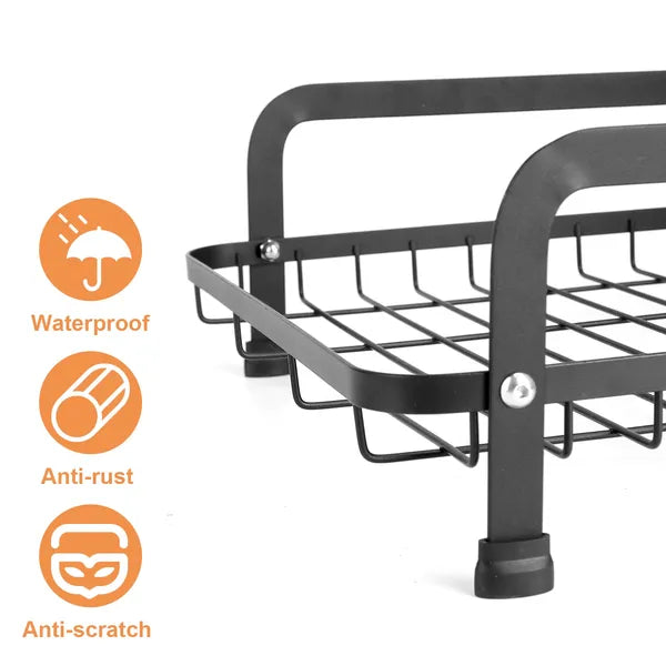 Close-up of a black metal, anti-rust, anti-scratch dish drying rack with a grid design.