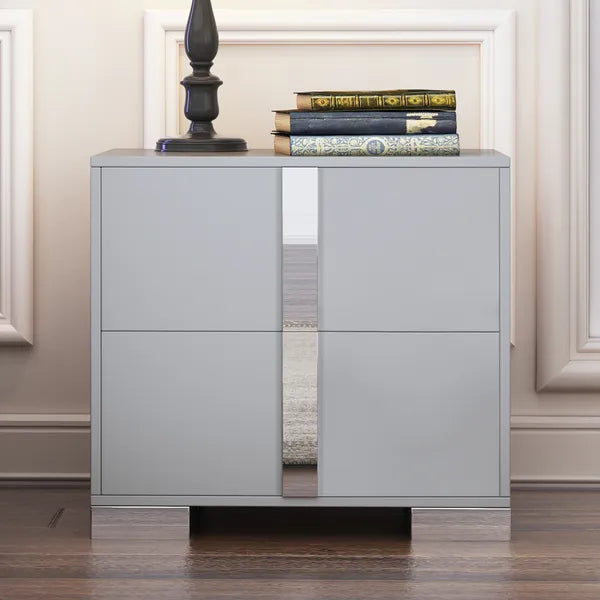 Gray nightstand with mirrored panels, two drawers, and sleek metal feet.