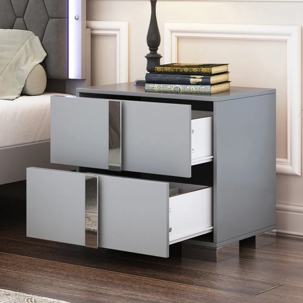 Gray mirrored nightstand with two open drawers, sleek metal feet, and a modern design.