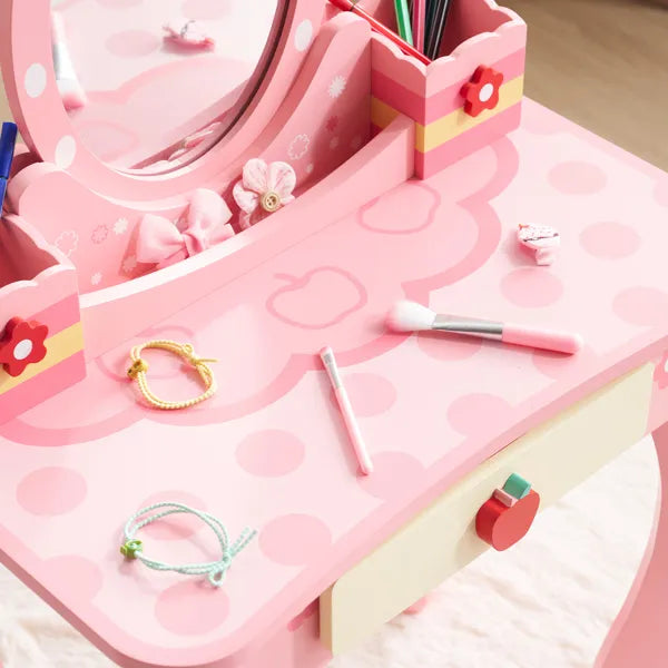 Pink MDF kids' vanity with oval mirror, apple print, single drawer, and playful accessories.