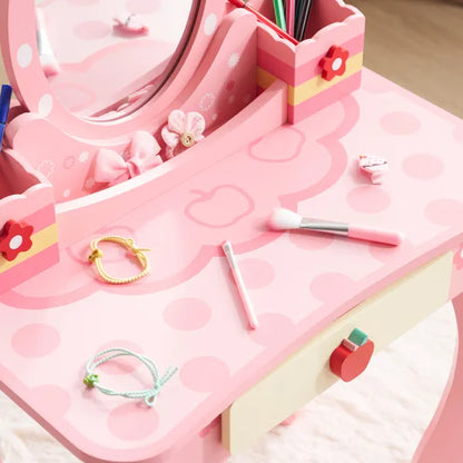Pink MDF kids' vanity with oval mirror, apple print, single drawer, and playful accessories.