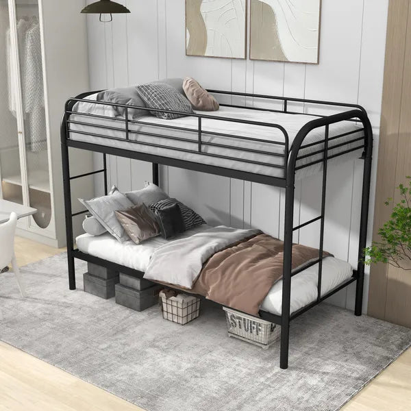 Black metal twin-over-twin bunk bed with rounded top frame, guard rails, and storage baskets underneath.