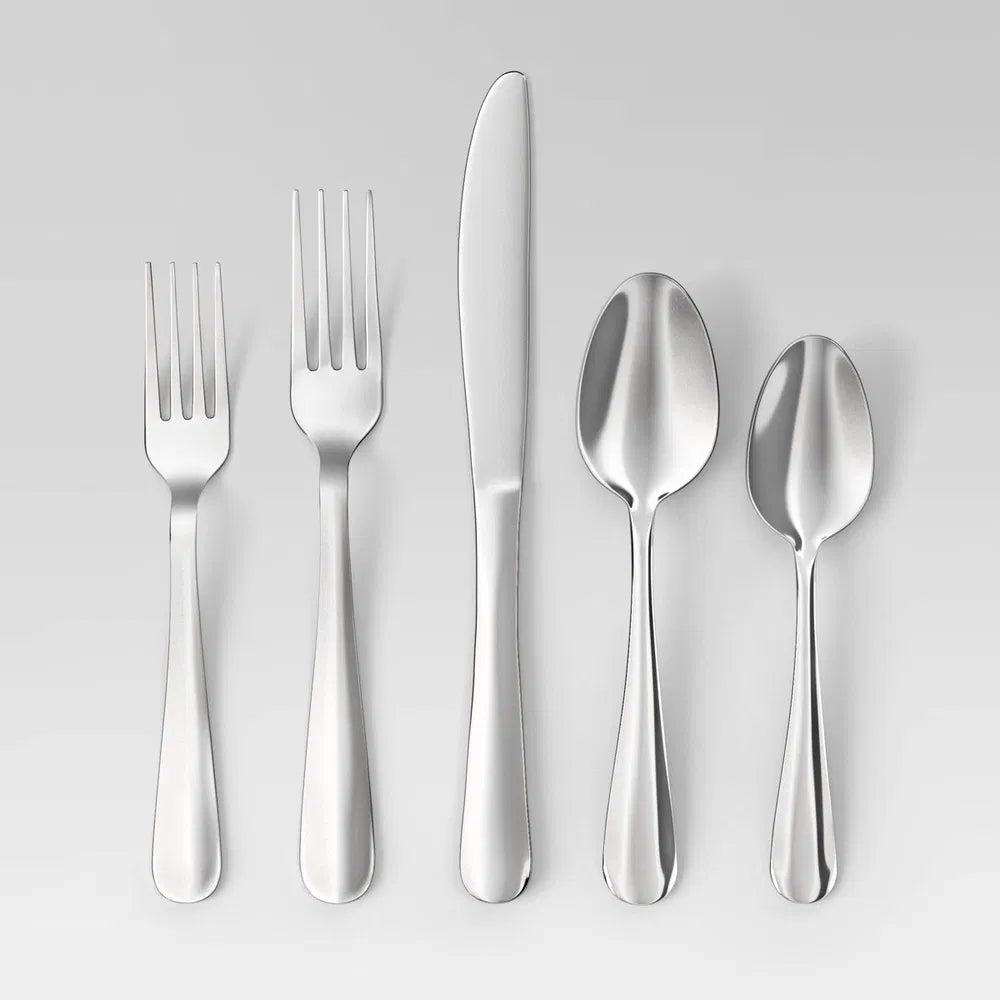 Modern 20-piece mirror-polished stainless steel silverware set with 5 utensils: dinner fork, salad fork, knife, dinner spoon, teaspoon.