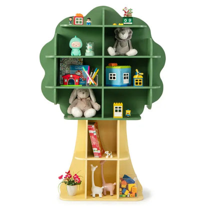 Sage green and yellow tree-shaped children's multi-tier bookcase with open storage shelves, filled with toys and books.