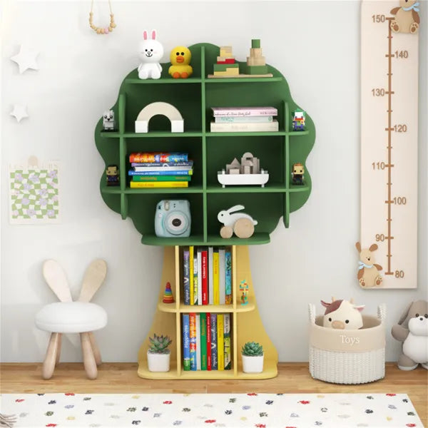 Sage green tree-shaped children's multi-tier bookcase with open shelves for books and toys.