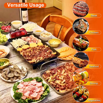 Black electric indoor/outdoor grill with various meats and vegetables cooking on a tabletop.