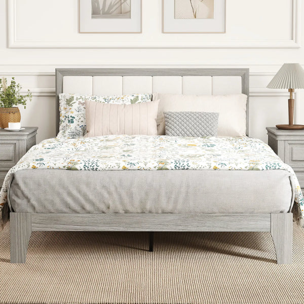 Modern full-size bed frame with a light gray wood finish and a white upholstered headboard.