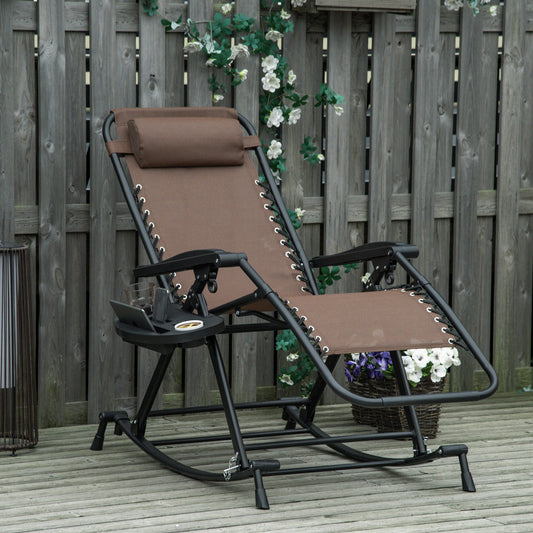 Espresso brown zero-gravity rocking chair with black frame, integrated side tray, and headrest on a wooden deck.
