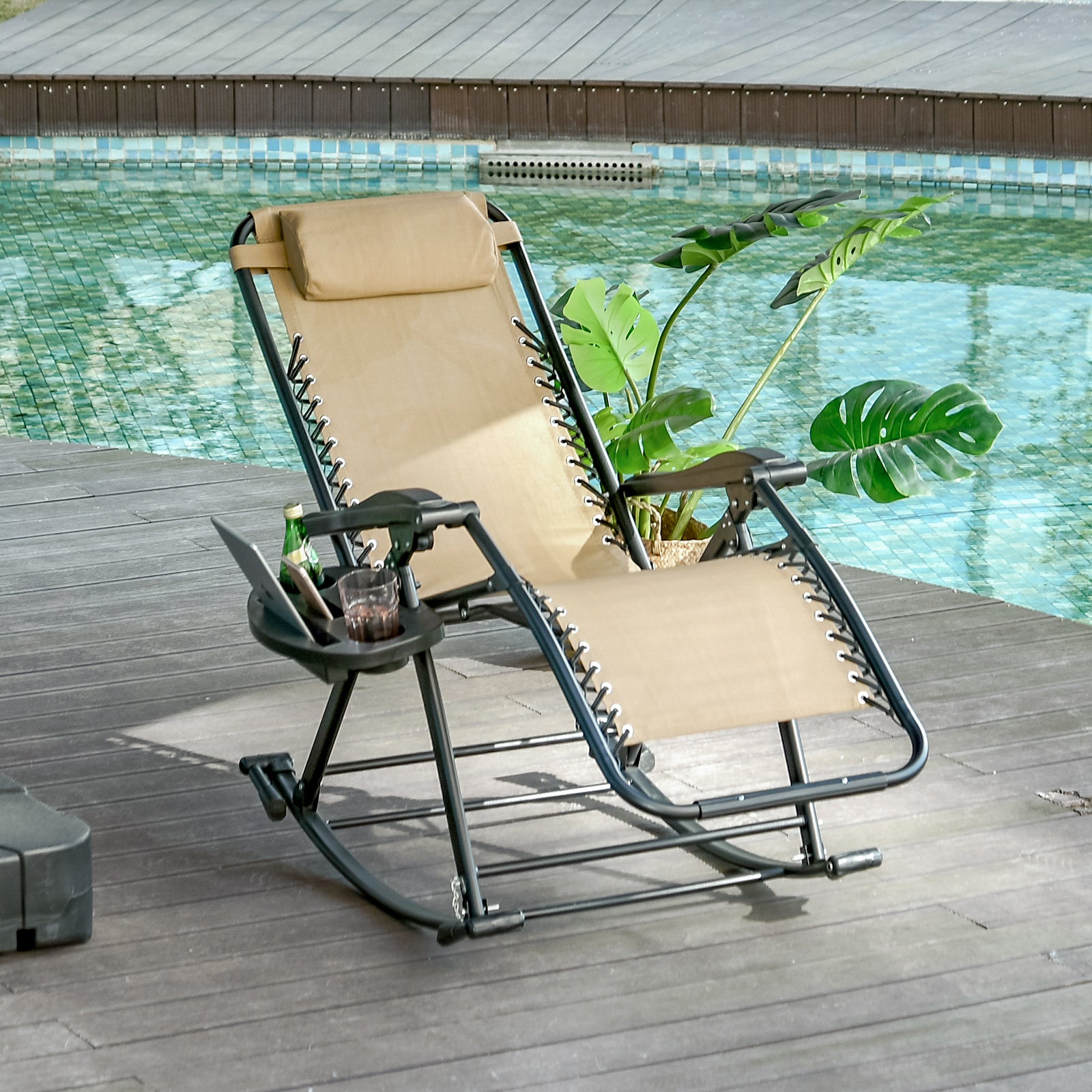 Sand beige zero gravity rocking chair with integrated side tray by a pool.