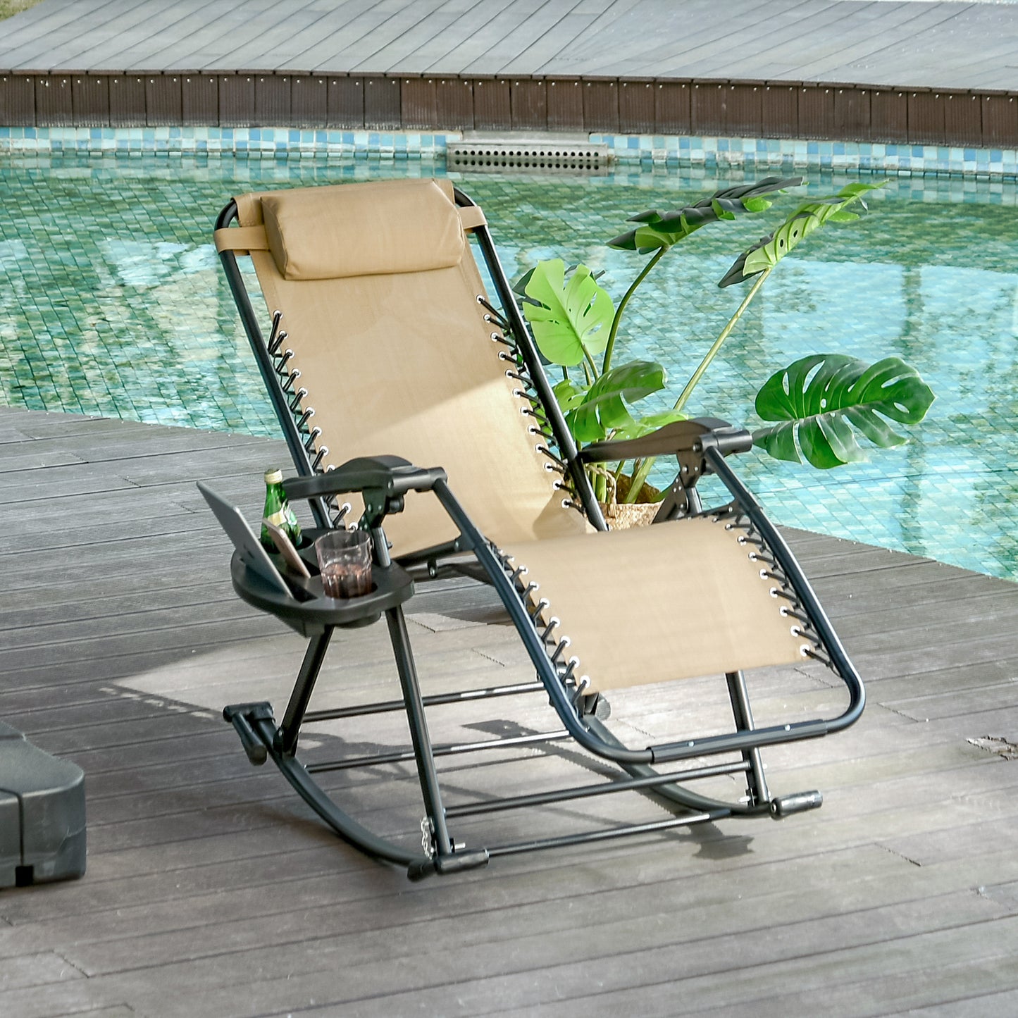 Sand beige zero gravity rocking chair with integrated side tray by a pool.