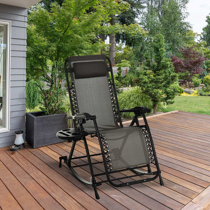 Steel gray zero gravity rocking chair with black frame and integrated side tray on a wooden deck.