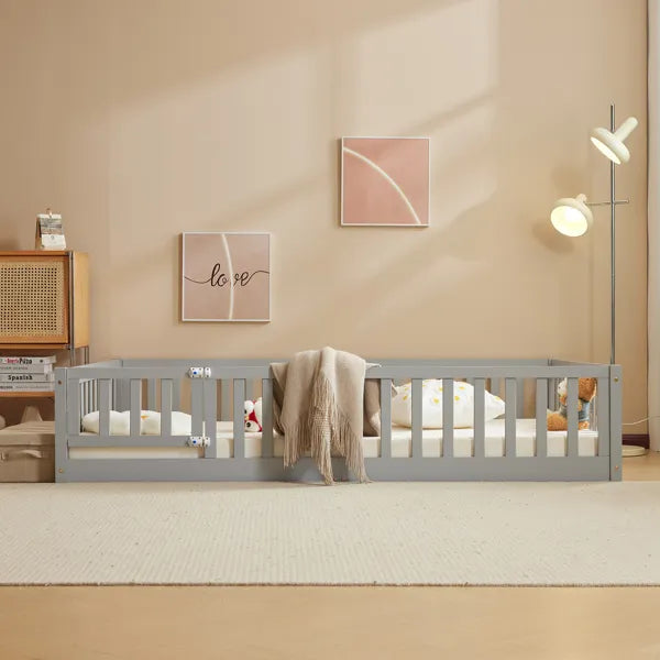 Gray pine wood full-size playpen bed with secure entry door, mattress, and blanket.
