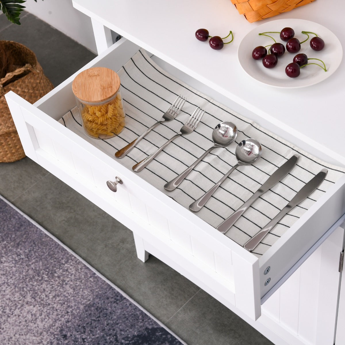 White MDF kitchen buffet hutch drawer with silverware and pasta jar, part of The Alabaster Organizer.