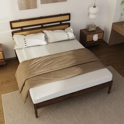 Dark walnut solid pine bed with double-woven rattan headboard, white bedding, and a brown throw.