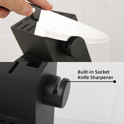 Hand sharpening a German Steel knife in a black contemporary storage block with a built-in sharpener.