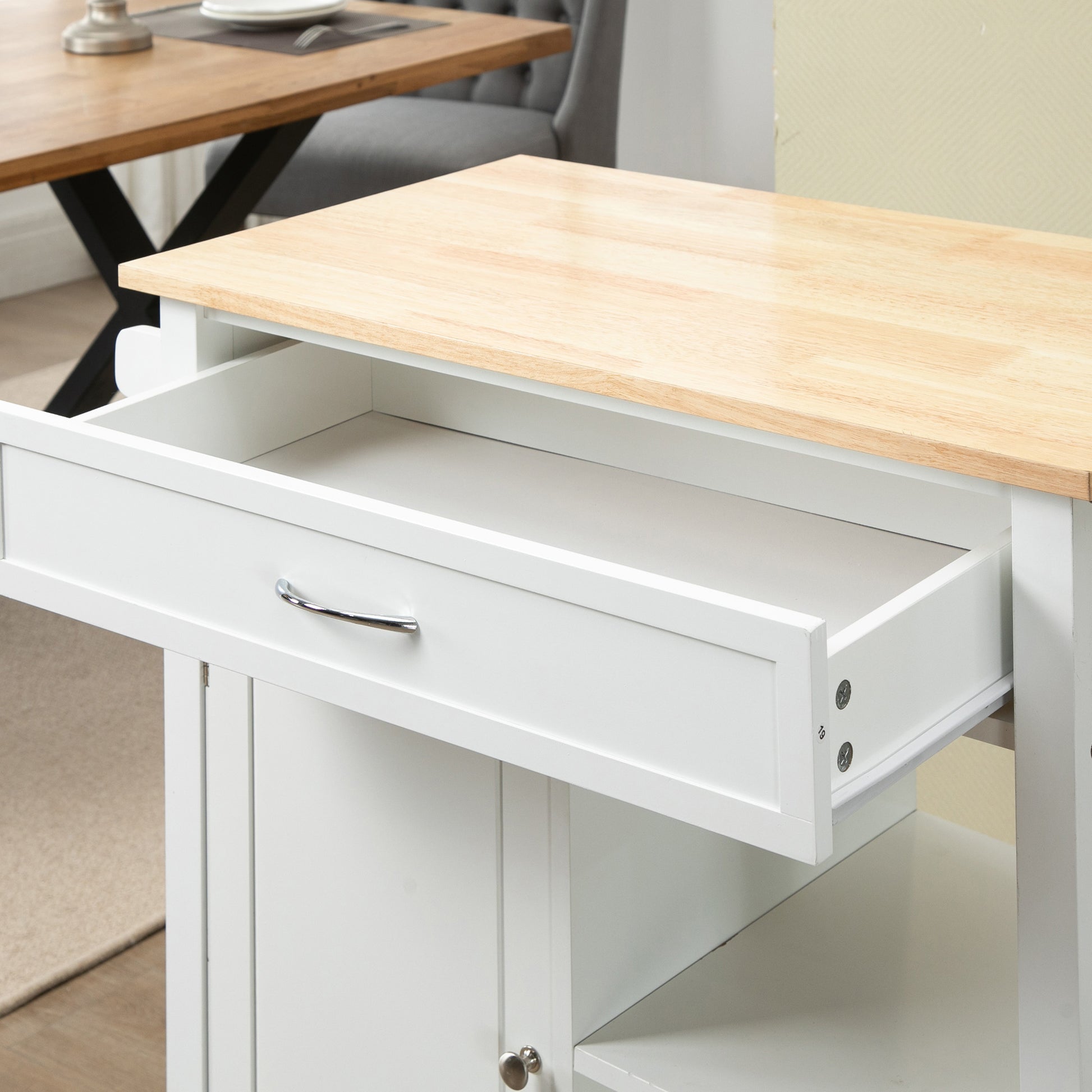 White mobile kitchen cart with a solid rubber wood top and an open storage drawer.
