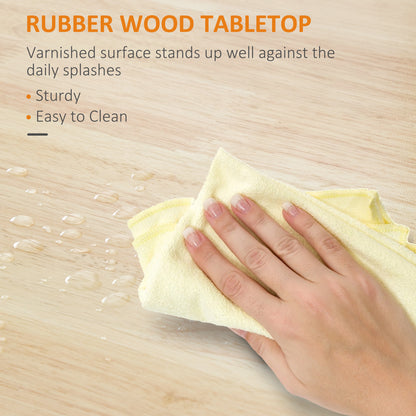 Close-up of a hand wiping water droplets from a light-colored rubber wood tabletop with a yellow cloth.