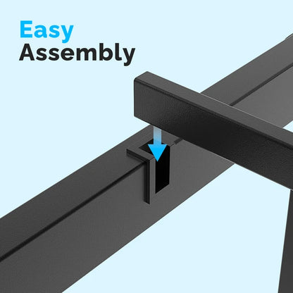 Close-up of black metal bed frame assembly, showing a slat sliding into a support beam.
