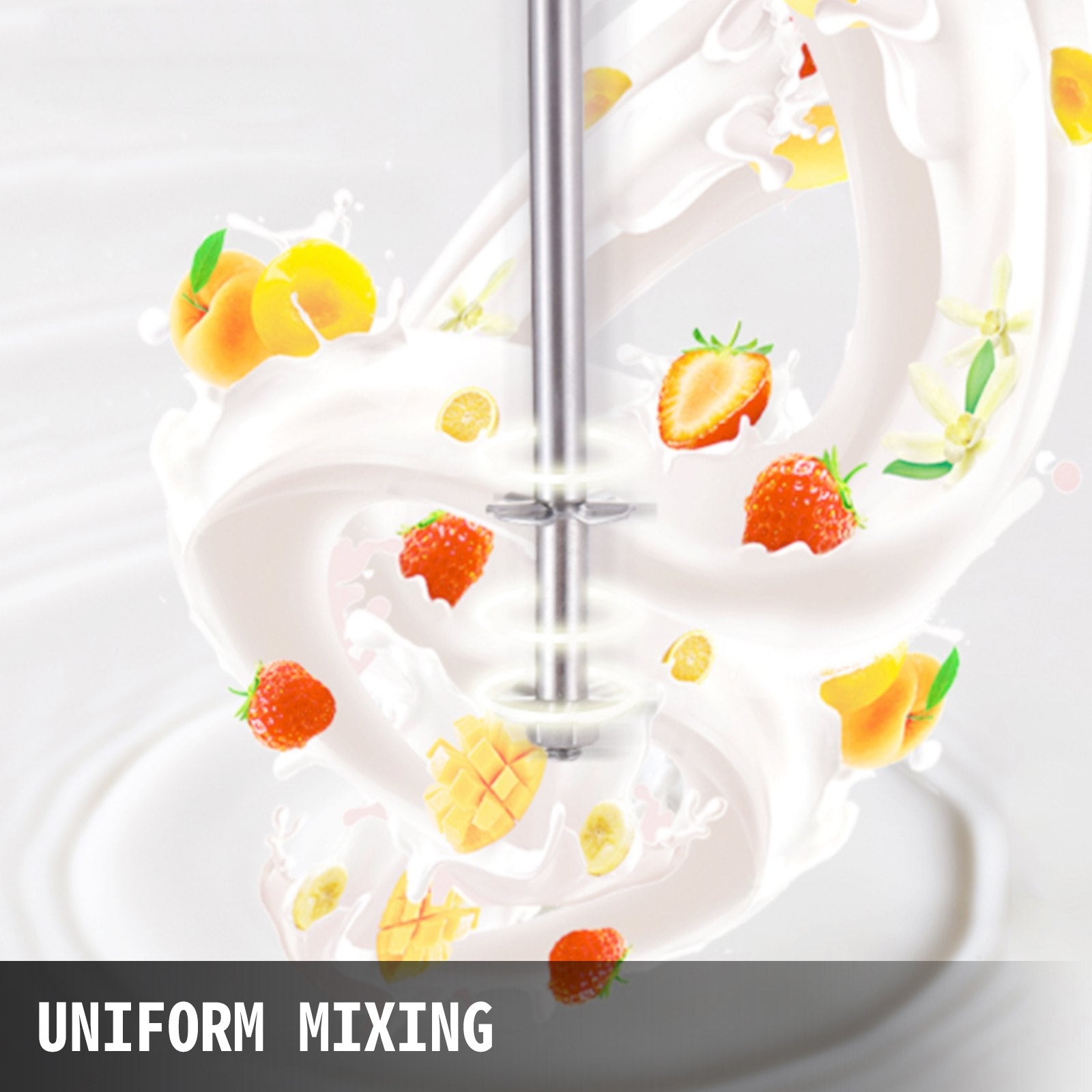 Stainless steel milkshake machine mixing milk with strawberries, peaches, mango, and bananas.