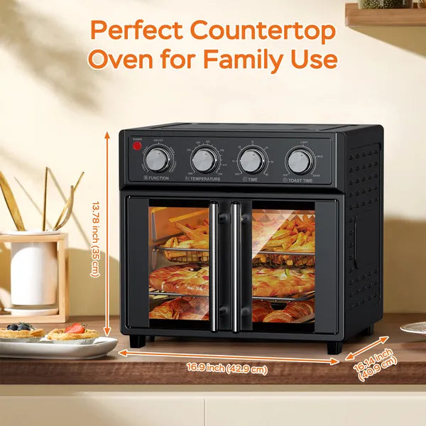 Black 29.5-quart convection oven with French doors, displaying food inside, on a kitchen countertop.