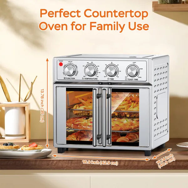 Silver 29.5-quart convection oven with French doors, displaying food and dimensions on a kitchen counter.