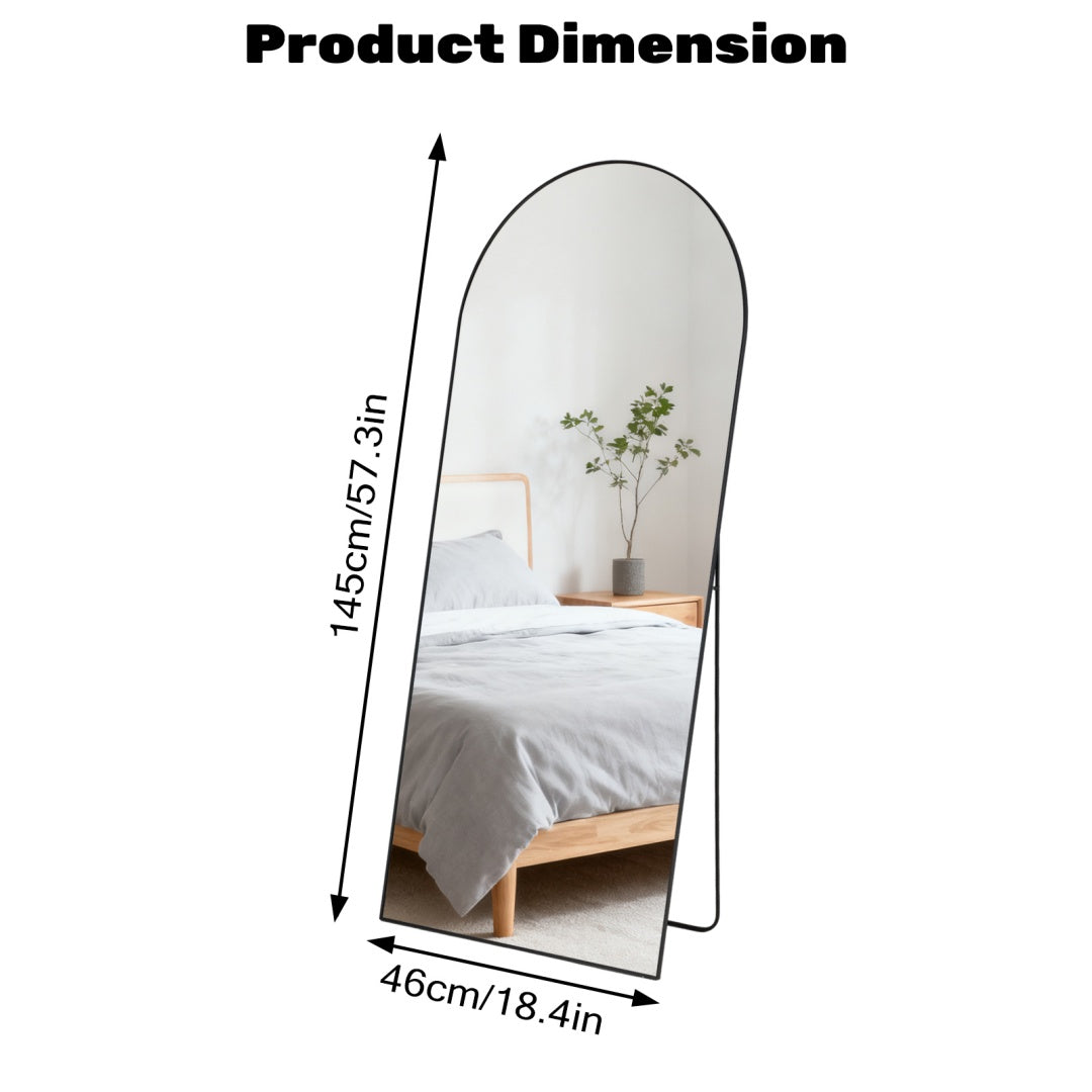 Black arched full-length standing mirror, 18.4x57.3 inches, reflecting a minimalist bedroom.