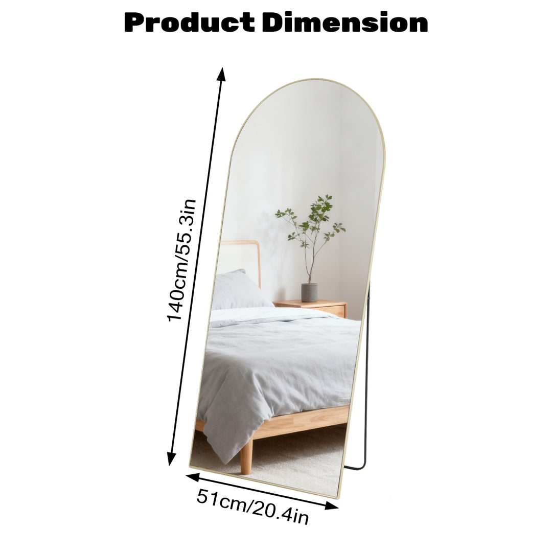 Golden arched full-length standing mirror, 20.4x55.3 inches, with a sleek metal frame, leaning in a bedroom.