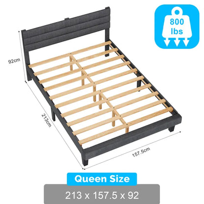 Queen upholstered bed frame in dark gray linen with horizontal tufted headboard and wood slat support.