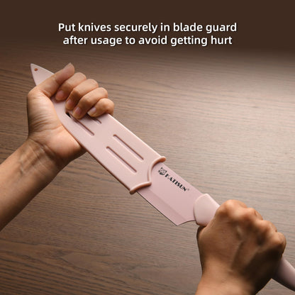 Hands sliding a pink KATISUN knife with a matching blade guard onto its blade.