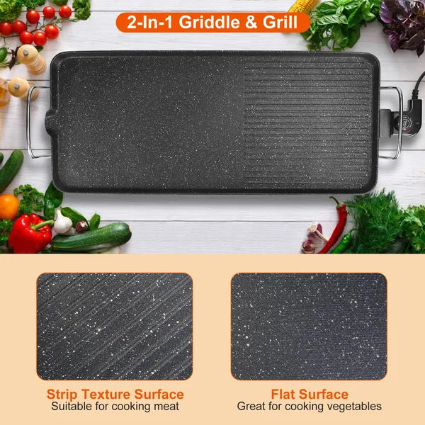 Black speckled 2-in-1 electric griddle and grill with flat and ridged non-stick surfaces, surrounded by fresh produce.