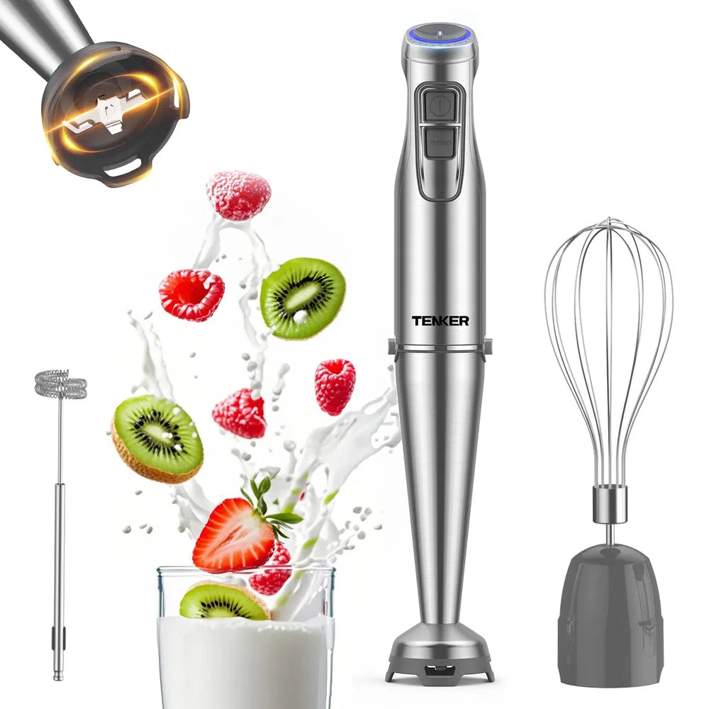Silver stainless steel immersion blender with whisk, frother, and fruit blending into milk.