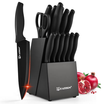 Black 15-piece Spectrum Chef knife set with block, scissors, and a built-in sharpener, beside pomegranates.