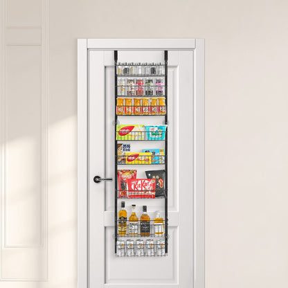 Black 8-tier metal over-door organizer with adjustable baskets, filled with pantry items on a white door.