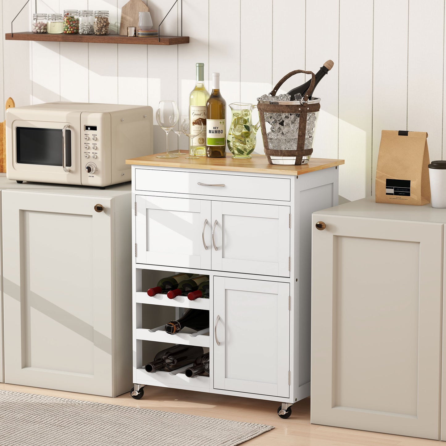 White rolling kitchen cart with wood top, 9-bottle wine rack, drawer, and double-door cabinet.