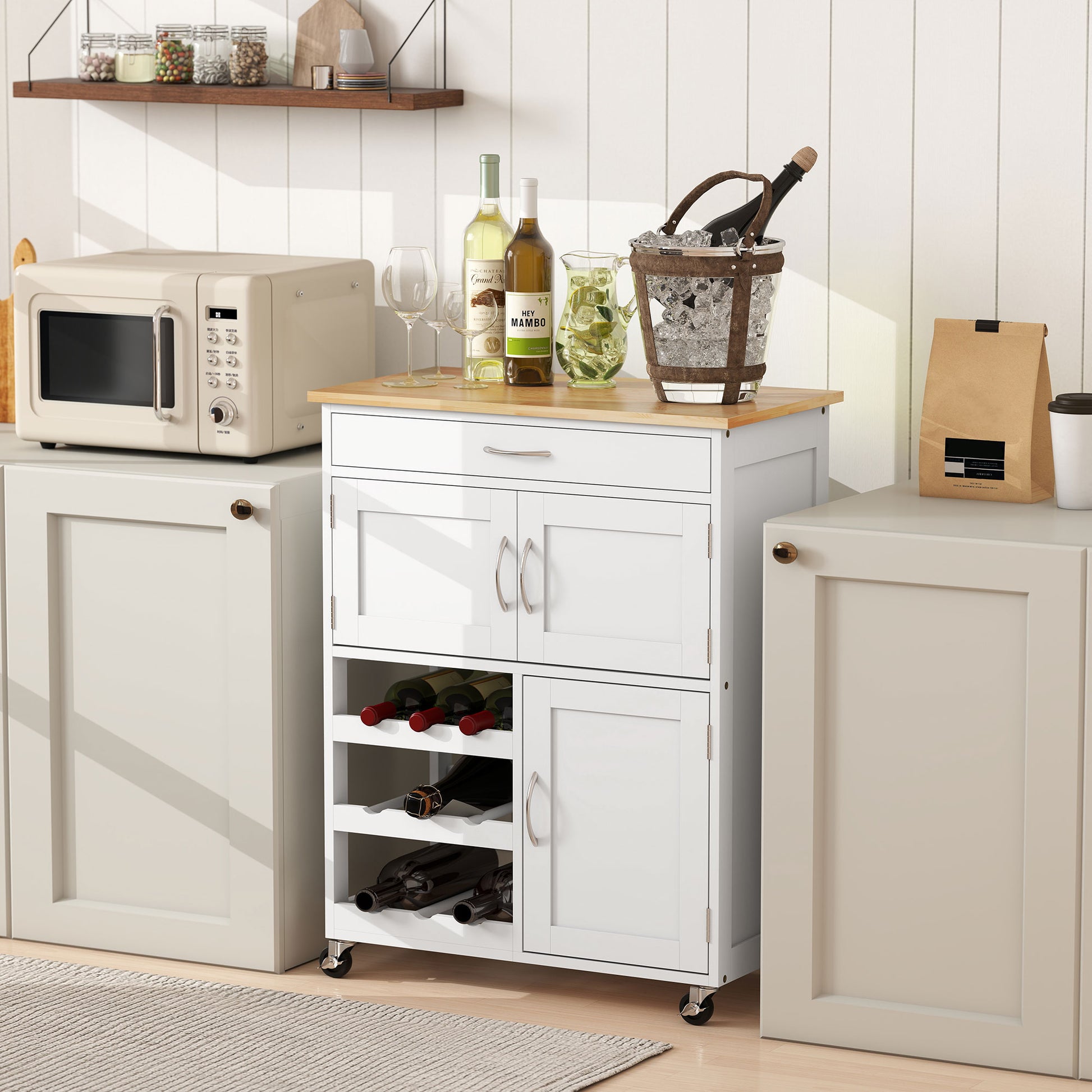White rolling kitchen cart with wood top, 9-bottle wine rack, drawer, and double-door cabinet.