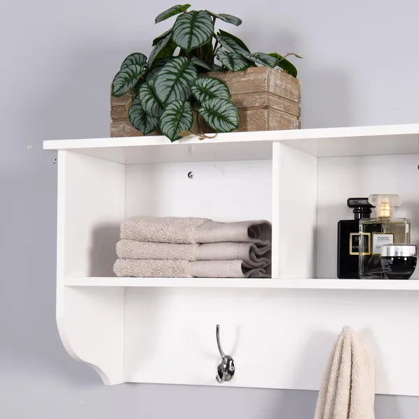 White wooden wall-mounted storage shelf with cubbies, a display top, and chrome dual hooks.